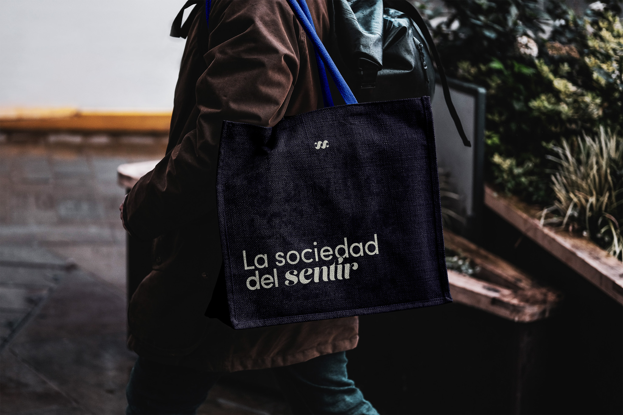 Free Eco Bag Carrying by Man Mockup-2